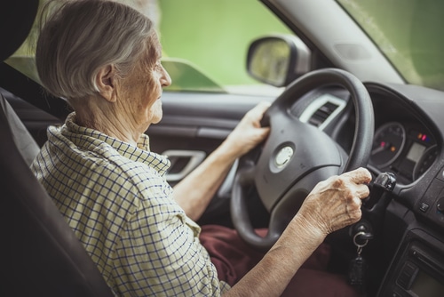 Old women driving car